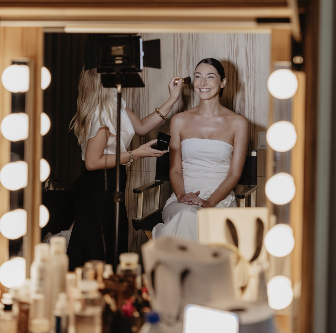 man kissing woman on her forehead